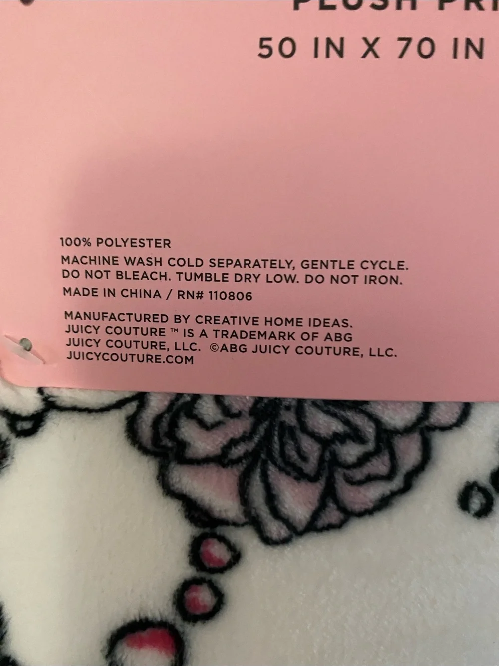 Juicy Couture White Plush Throw with Pink Perfume Bottle and Black Accents